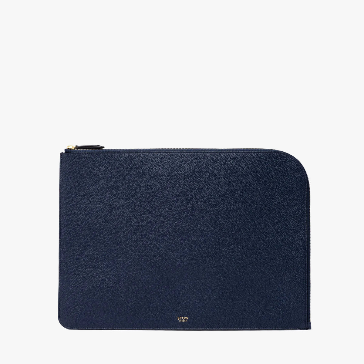 STOW London's Leather Sleeve in Navy pebbled leather on a light grey background featuring a YKK Natulon Zip and a fine gold embossed logo on the front bottom. 
