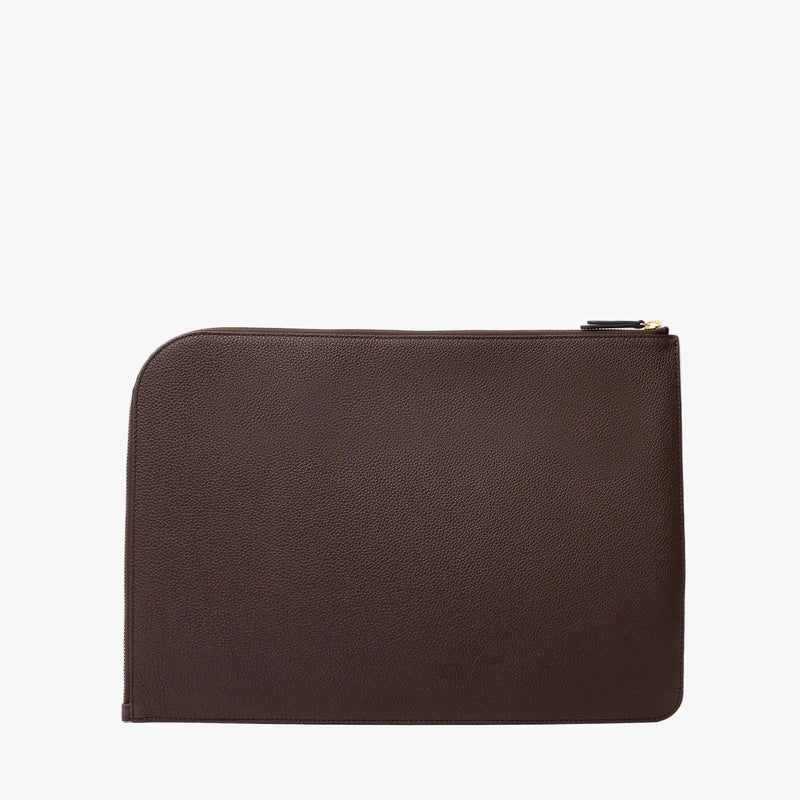 Back panel on STOW London's Leather Sleeve in Espresso pebbled leather on a light grey background featuring a YKK Natulon Zip