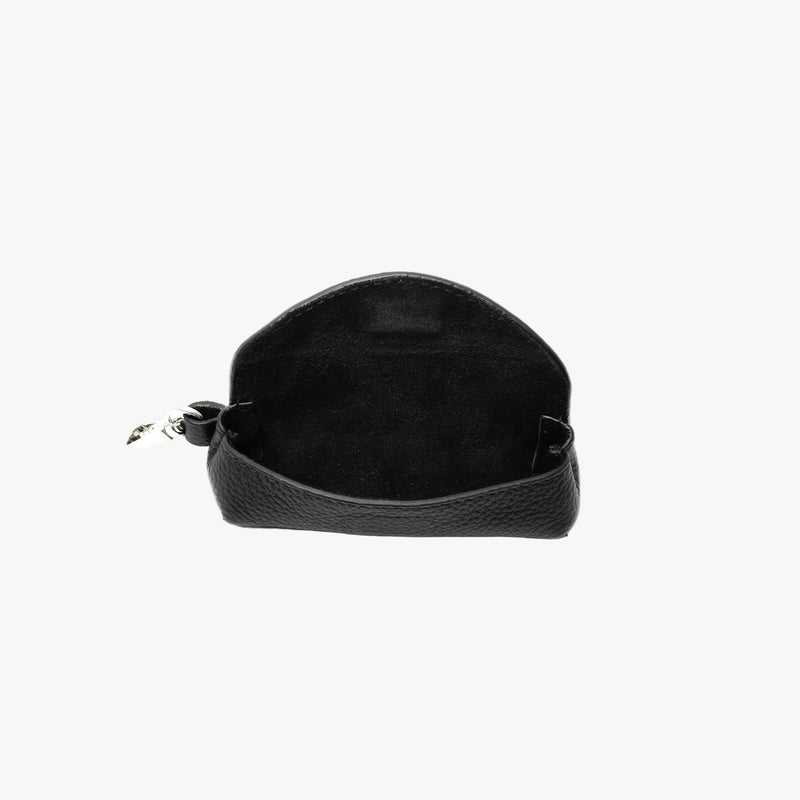 STOW London's Lipstick Case in Black pebbled leather with flap open showing hidden magnetic closure and black suede interior featuring a silver stainless steel clip on a light grey background