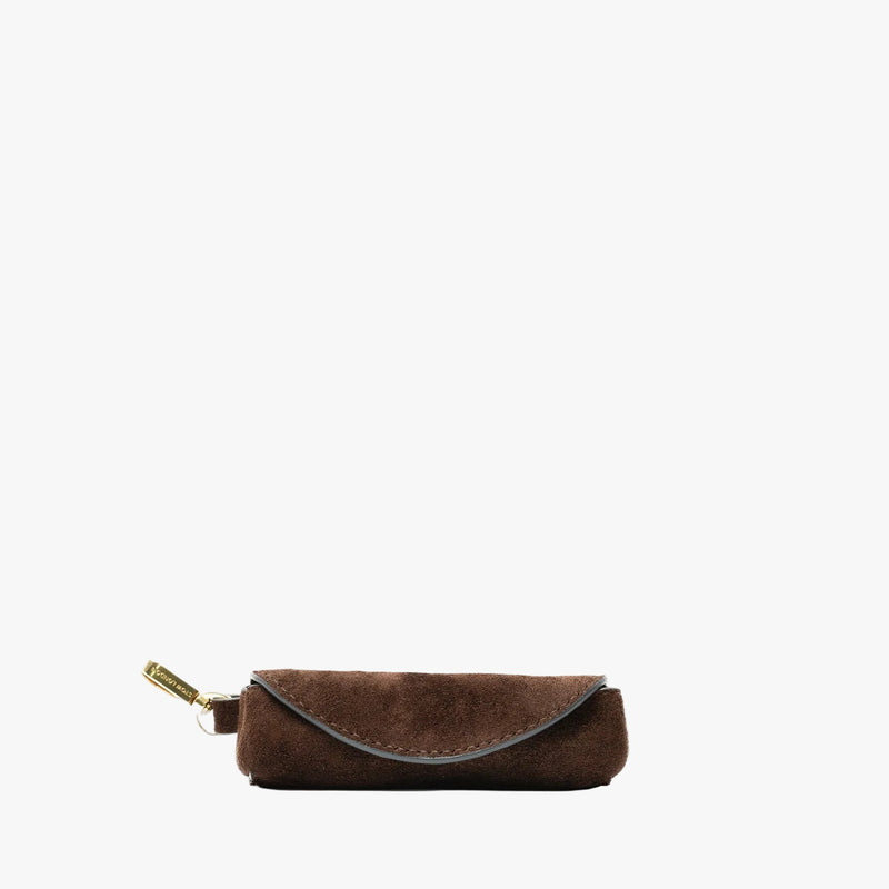 STOW London's Lipstick Case in Chocolate suede leather on a light grey background featuring a gold-coated stainless steel clip