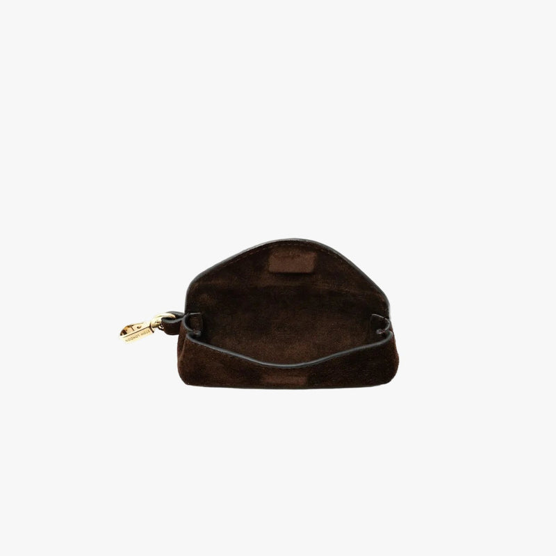 STOW London's Lipstick Case in Chocolate suede leather with flap open showing hidden magnetic closure and suede interior on a light grey background featuring a gold-coated stainless steel clip