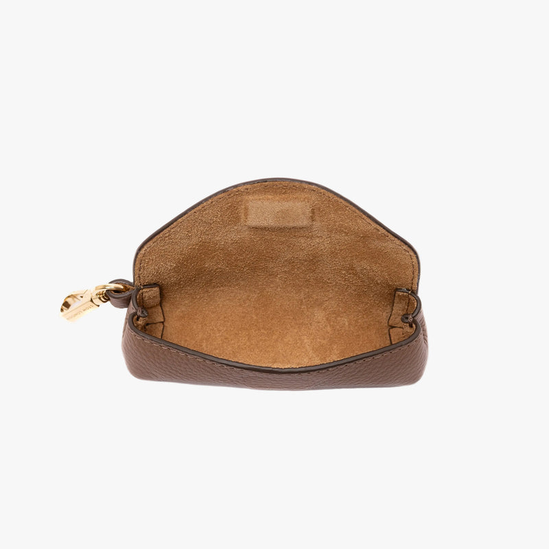 STOW London's Lipstick Case in Mocha pebbled leather on a light grey background with flap open showing suede interior lining and hidden magnetic closure featuring gold-coated stainless steel hardware