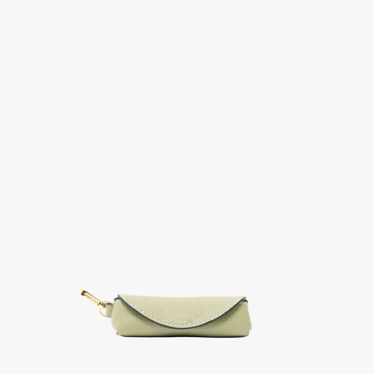 STOW London's Lipstick Case in Pale Green pebbled leather featuring a gold-coated stainless steel clip on a light grey background