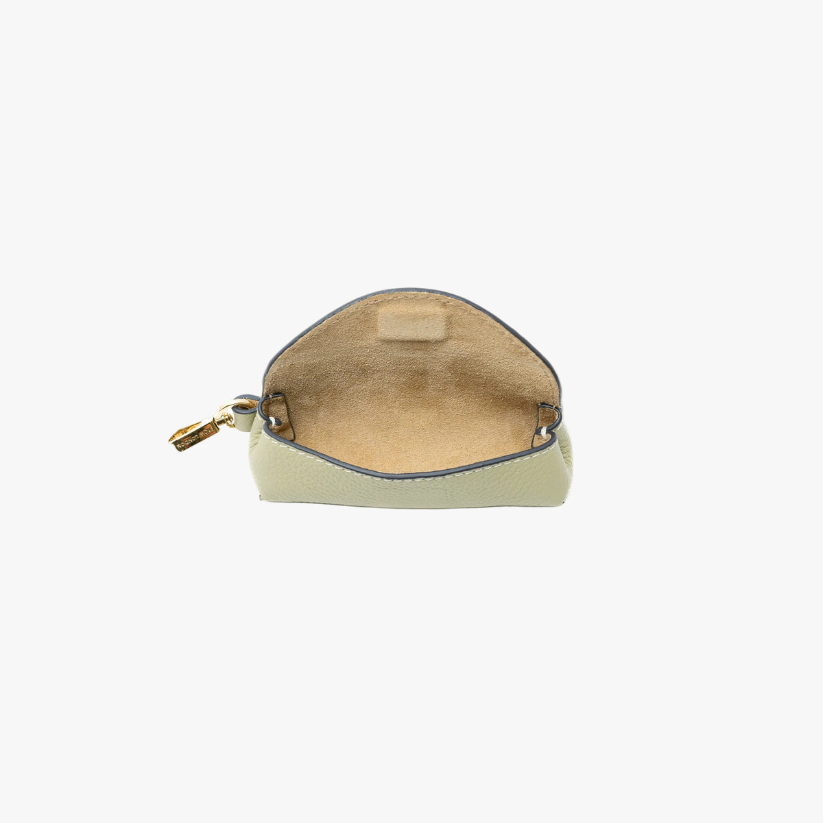 STOW London's Lipstick Case in Pale Green pebbled leather with flap open showing hidden magnetic closure and suede interior lining featuring a gold-coated stainless steel clip on a light grey background