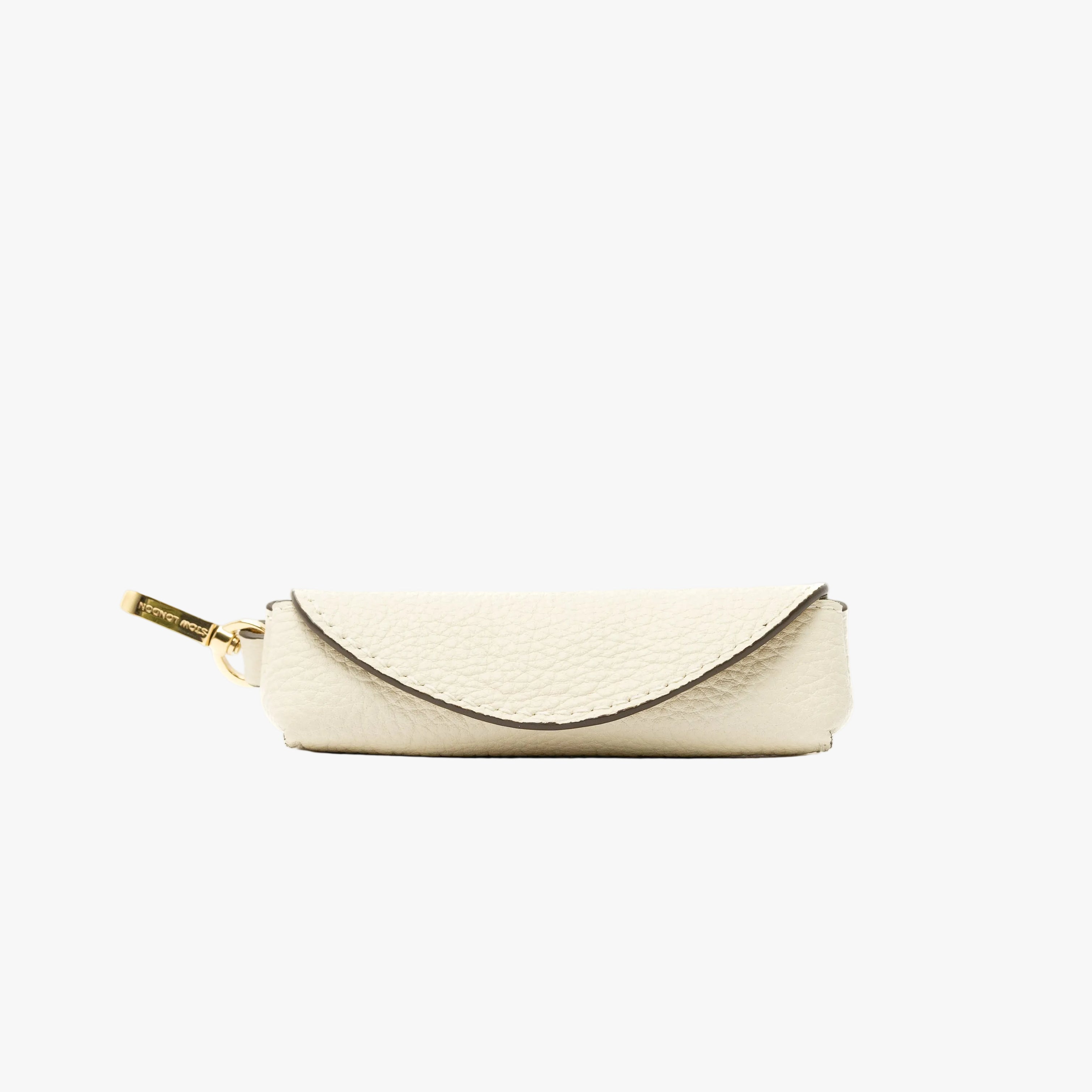 STOW London's Lipstick Case in Spring Moon pebbled leather featuring a gold-coated stainless steel clip on a light grey background