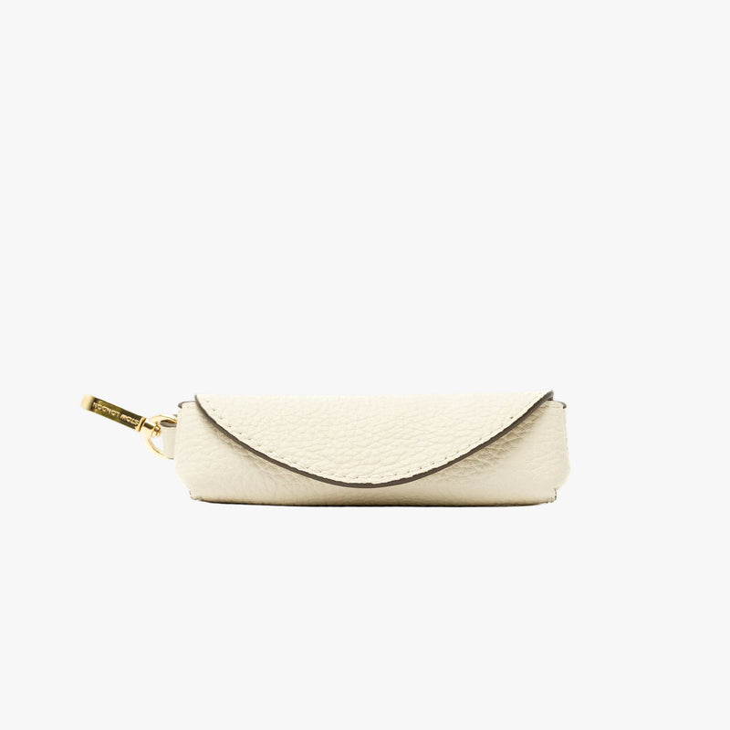 STOW London's Lipstick Case in Spring Moon pebbled leather featuring a gold-coated stainless steel clip on a light grey background