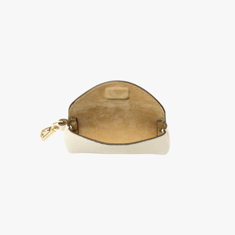 STOW London's Lipstick Case in Spring Moon pebbled leather with flap open showing the hidden magnetic closure and suede interior lining featuring a gold-coated stainless steel clip on a light grey background