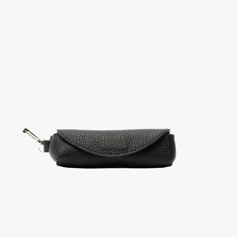 STOW London's Lipstick Case in Black pebbled leather featuring a silver stainless steel clip on a light grey background