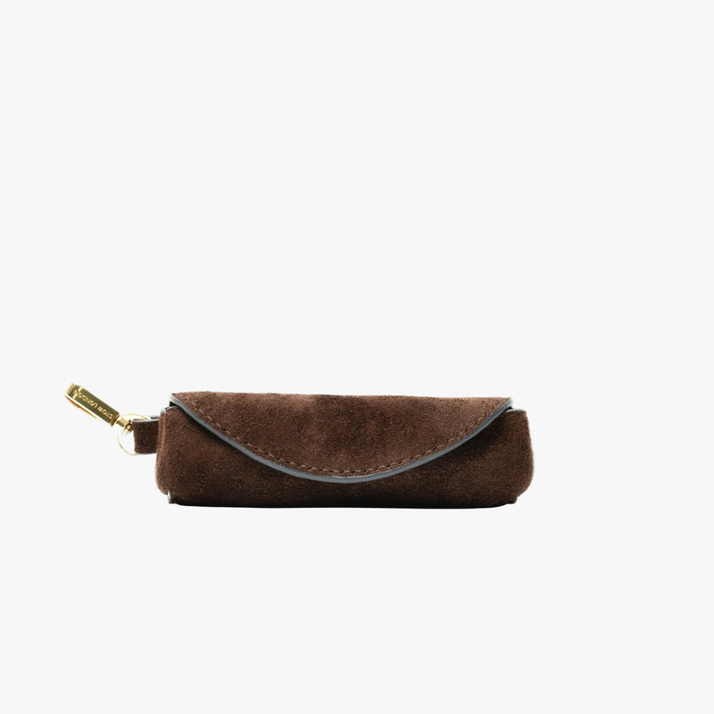 STOW London's Lipstick Case in Chocolate suede leather featuring a gold-coated stainless steel clip on a light grey background