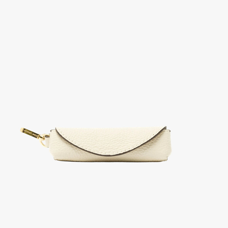 STOW London's Lipstick Case in Spring Moon pebbled leather featuring a gold-coated stainless steel clip on a light grey background