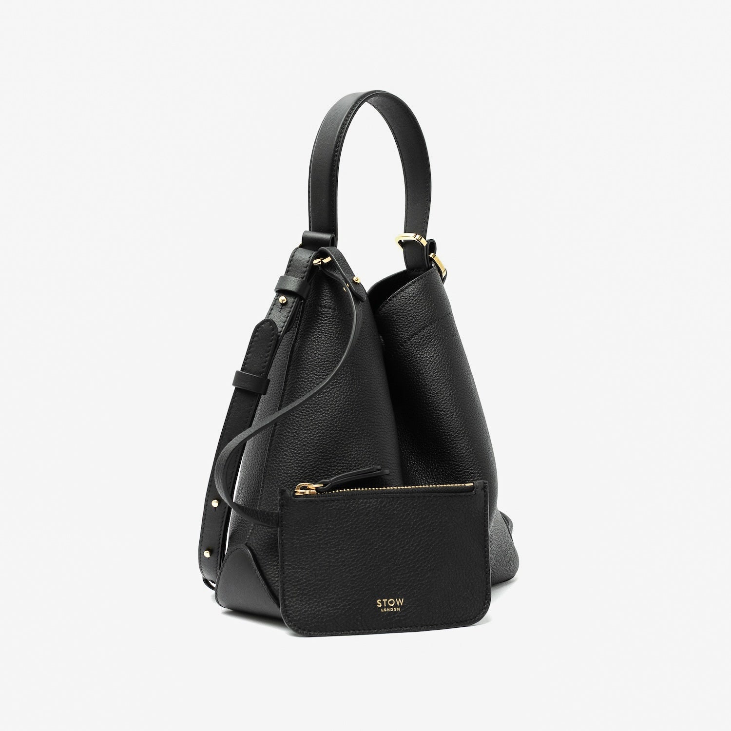 STOW London's Midi Curve in Black pebbled leather with its matching, detachable interior pouch featuring gold-coated stainless steel hardware on a light grey background