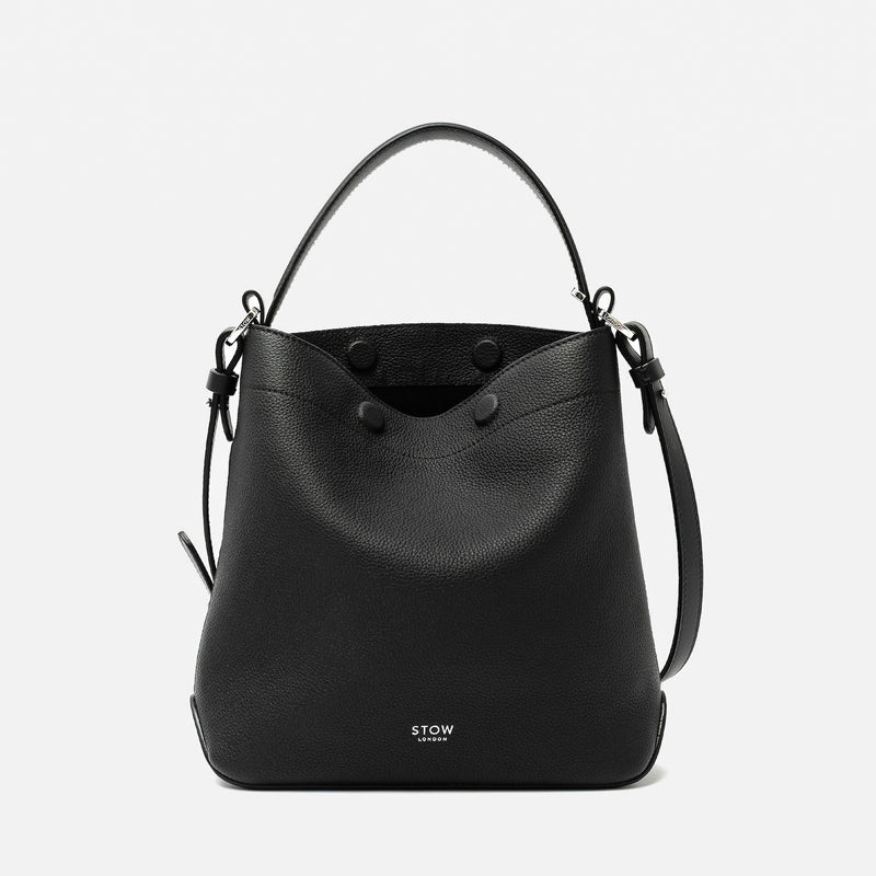 STOW London's Midi Curve in Black pebbled leather featuring silver stainless steel hardware on a light grey background