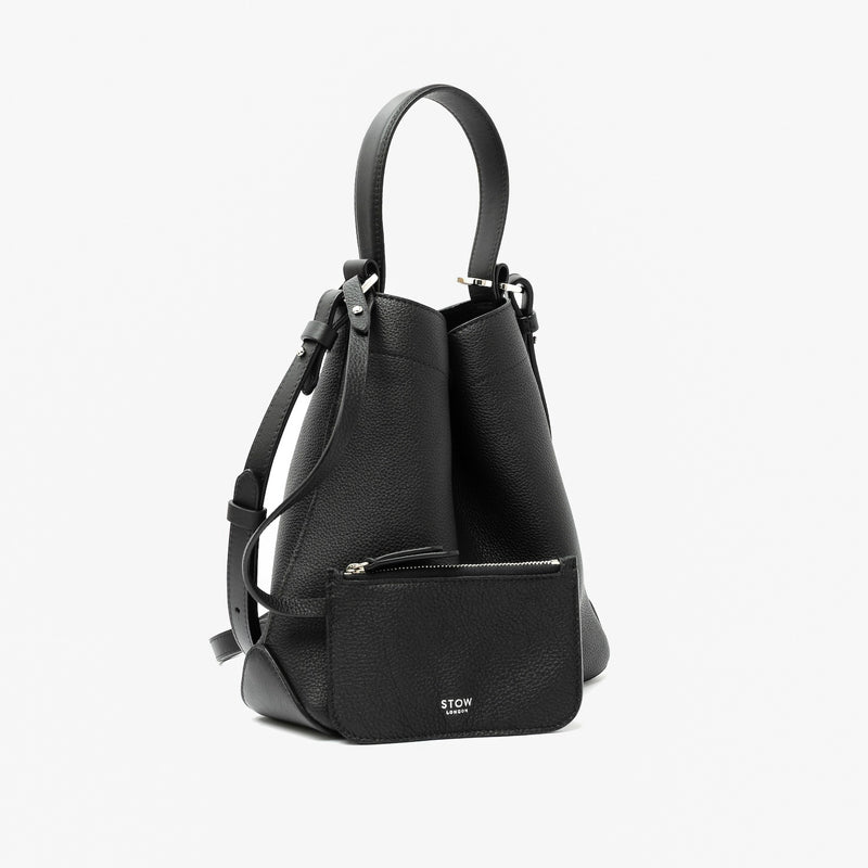 STOW London's Midi Curve in Black pebbled leather with its matching, detachable interior pouch featuring silver stainless steel hardware on a light grey background
