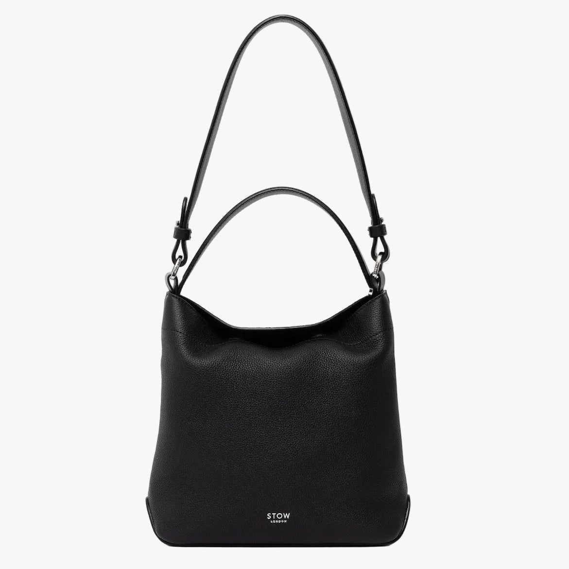 STOW London's Midi Curve and detachable shoulder strap and top handle in Black leather on a light grey background featuring silver hardware and details 