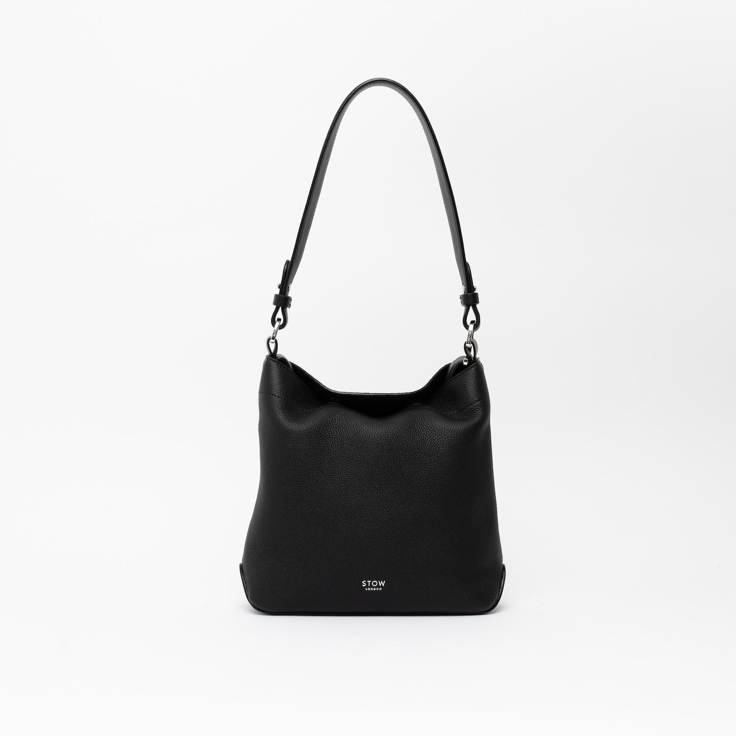STOW London's Midi Curve and detachable shoulder strap in Black leather on a light grey background featuring silver hardware and details 