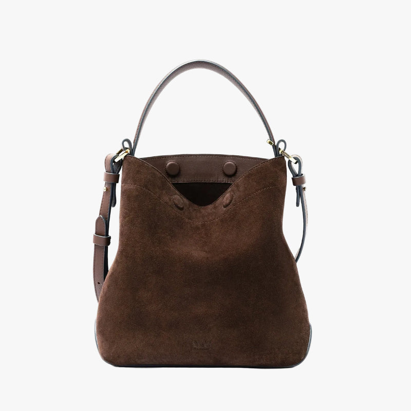 STOW London's Midi Curve in Chocolate suede leather styled and crossbody strap  featuring gold-coated stainless steel hardware on a light grey background