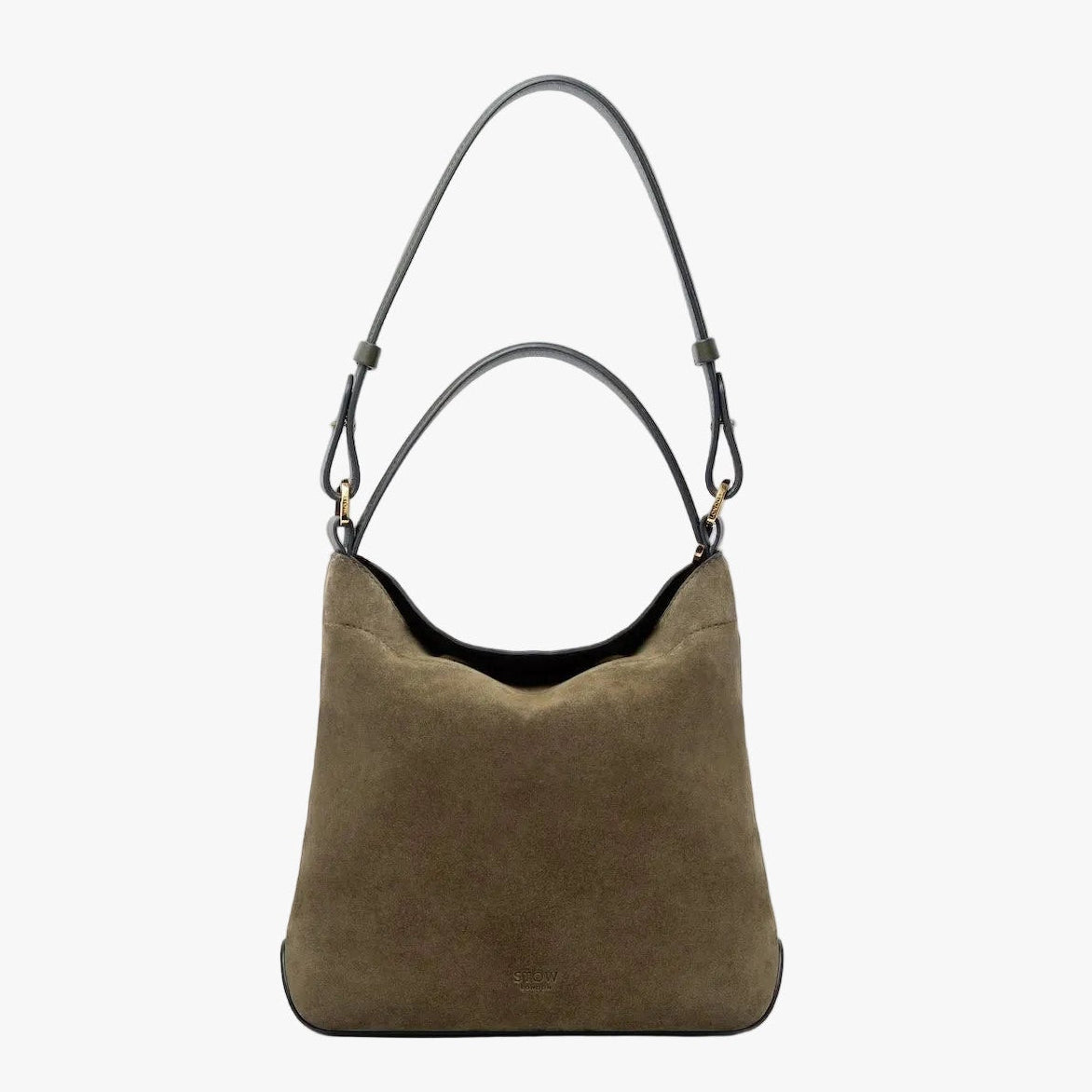 STOW London's Midi Curve in Dark Green suede leather on a light grey background featuring the detachable shoulder strap and top handle with gold hardware and details 