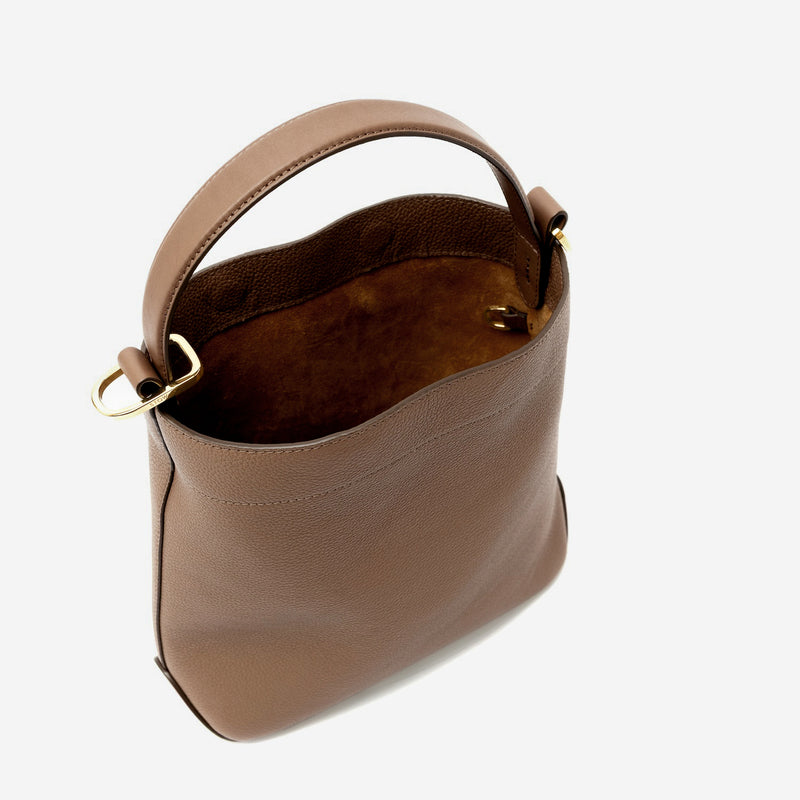 STOW London's Midi Curve in Mocha pebbled leather with magnets open showing the suede interior and d-ring featuring gold-coated stainless steel hardware on a light grey background