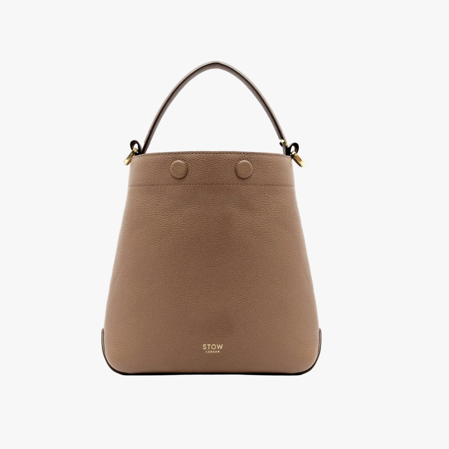 STOW London's Midi Curve bag in Mocha pebbled leather styled as a bucket bag featuring gold-coated stainless steel hardware on a light grey background