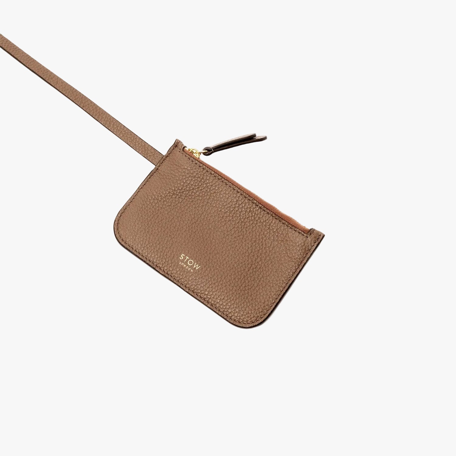 The matching interior, detachable pouch from STOW London's Midi Curve bag in Mocha pebbled leather featuring gold-coated stainless steel hardware on a light grey background