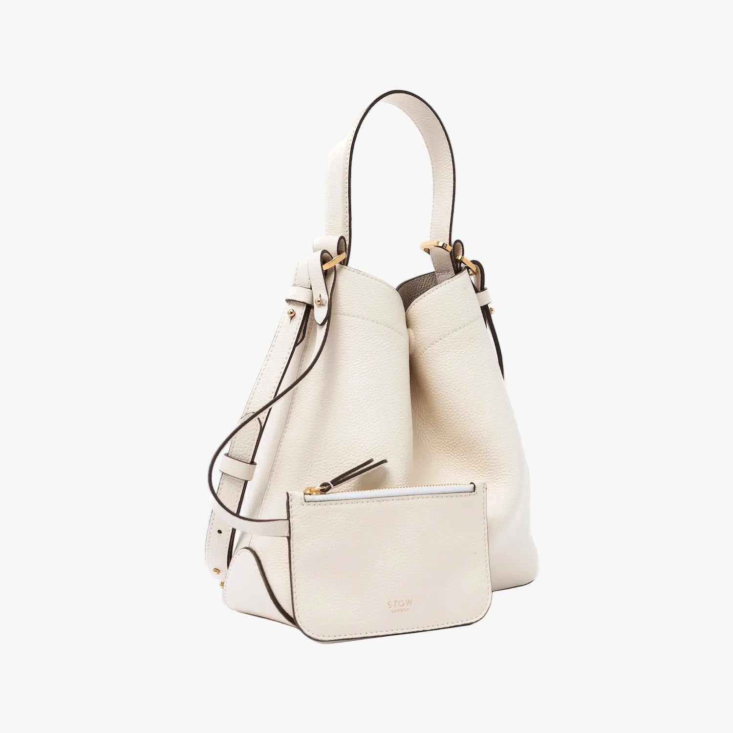 STOW London's Midi Curve in Spring Moon pebbled leather with its detachable crossbody strap  and matching, detachable interior zip pouch featuring gold-coated stainless steel hardware on a light grey background