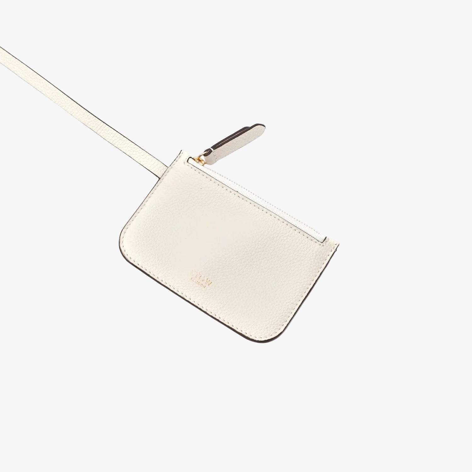 Detachable interior pouch from STOW London's Midi Curve in Spring Moon pebbled leather featuring gold-coated stainless steel hardware on a light grey background