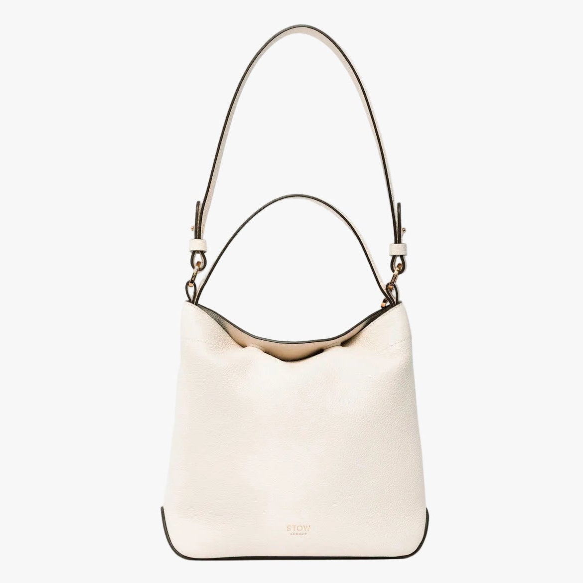 STOW London's Midi Curve in Spring Moon leather on a light grey background featuring the detachable shoulder strap with gold hardware and details 