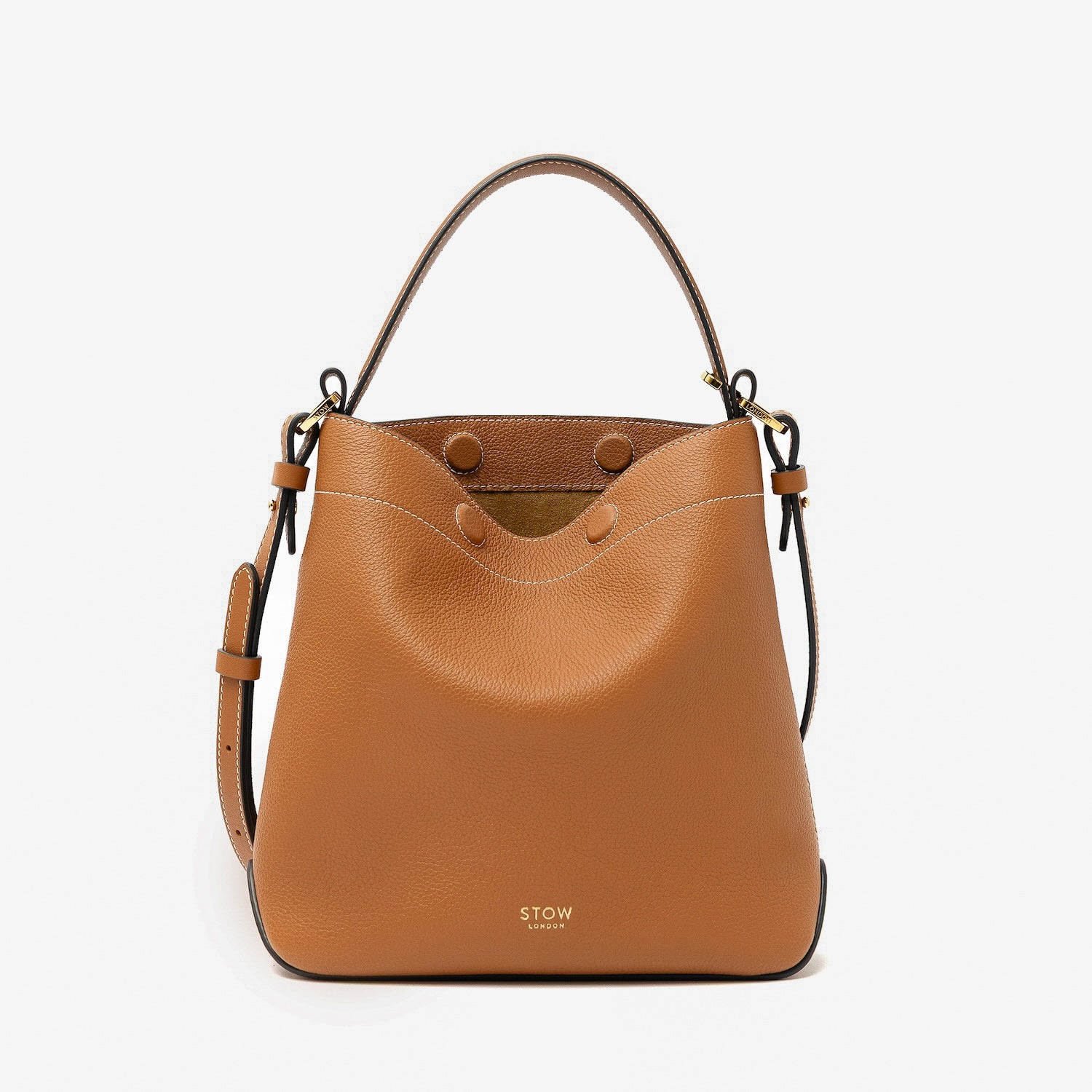 STOW London's Midi Curve in Earth Tan pebbled leather featuring gold-coated stainless steel hardware on a light grey background
