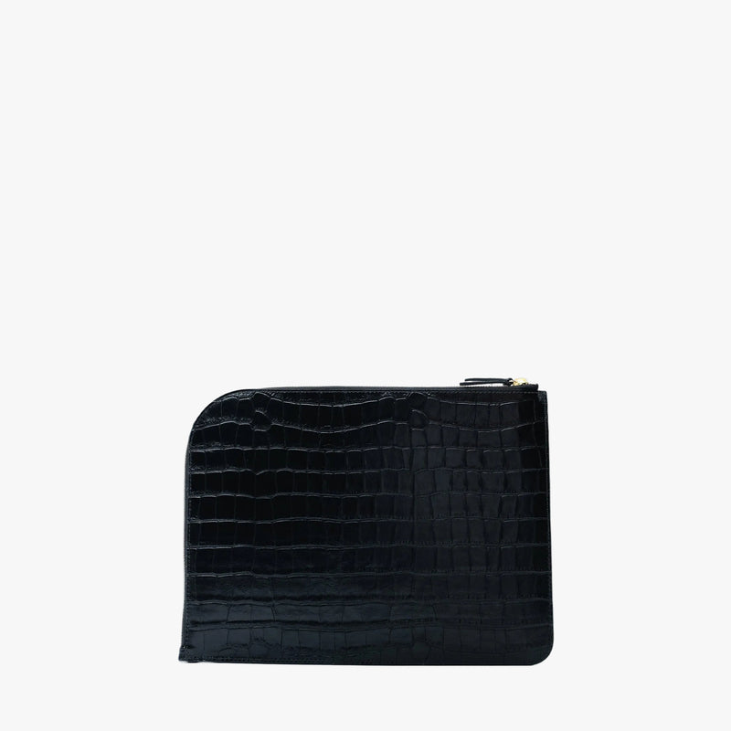 Back panel of STOW London's Midi Leather Sleeve in Black Embossed Croc leather on a light grey background featuring a YKK Natulon Zip