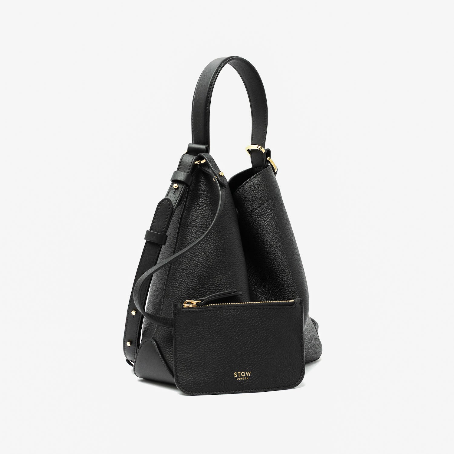 STOW London's Midi Curve in Black pebbled leather with its matching, detachable interior pouch featuring gold-coated stainless steel hardware on a light grey background