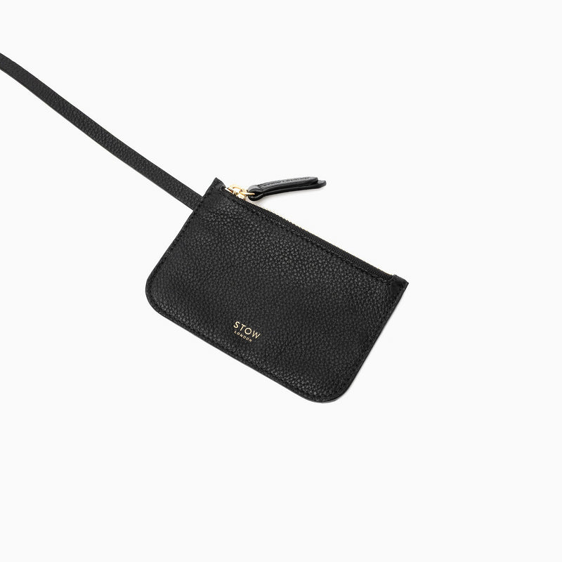 Close up of the detachable interior pouch from STOW London's Midi Curve in Black pebbled leather on a light grey background