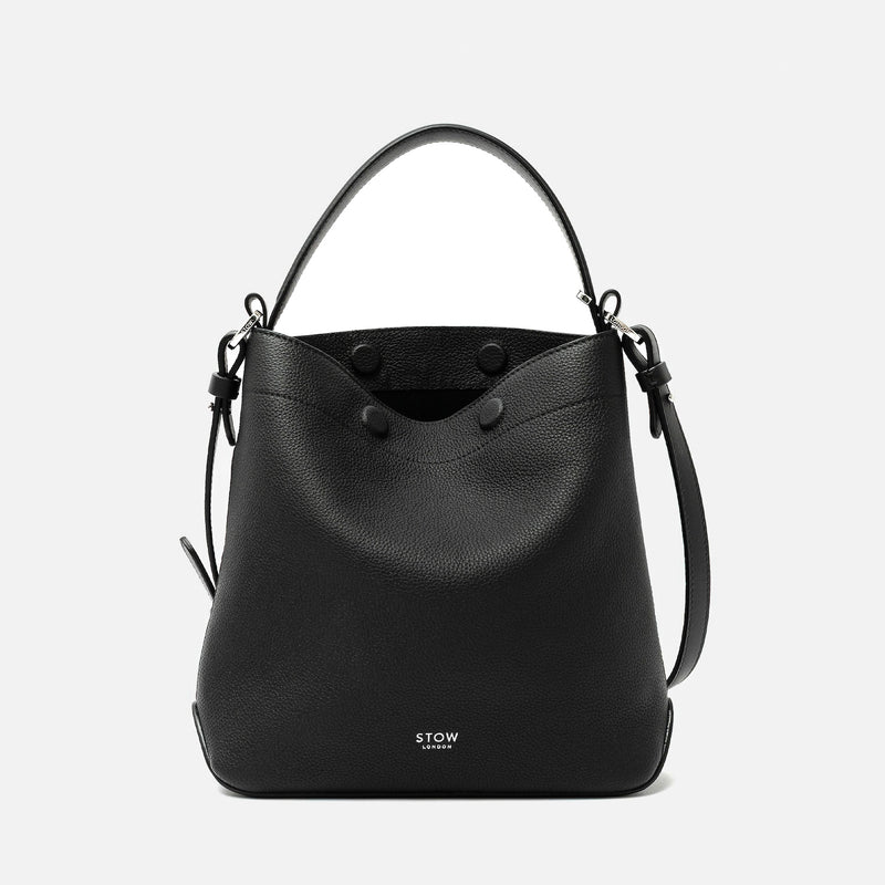 STOW London's Midi Curve in Black pebbled leather featuring silver stainless steel hardware on a light grey background