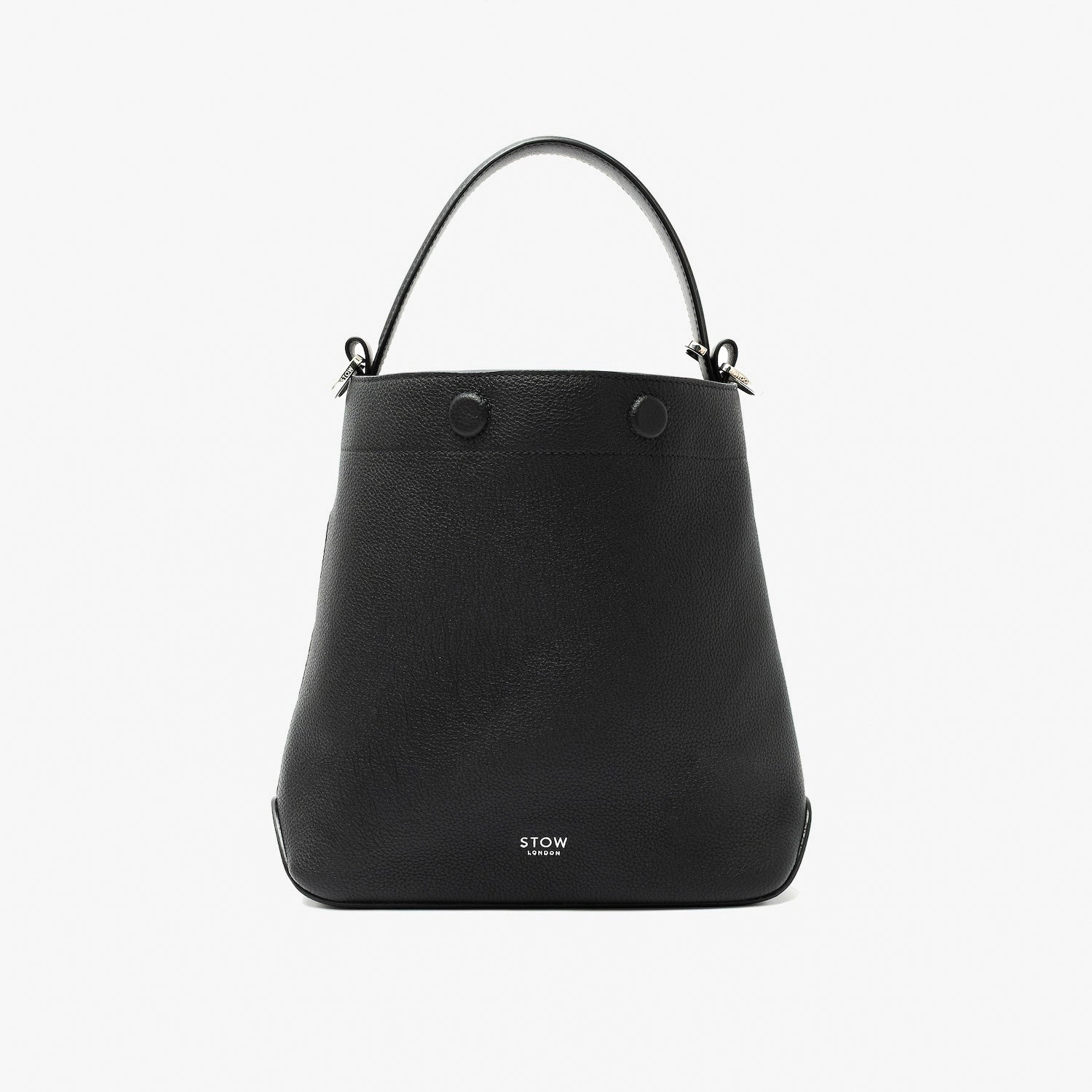 STOW London's Midi Curve in Black pebbled leather styled as a bucket bag featuring silver stainless steel hardware on a light grey background