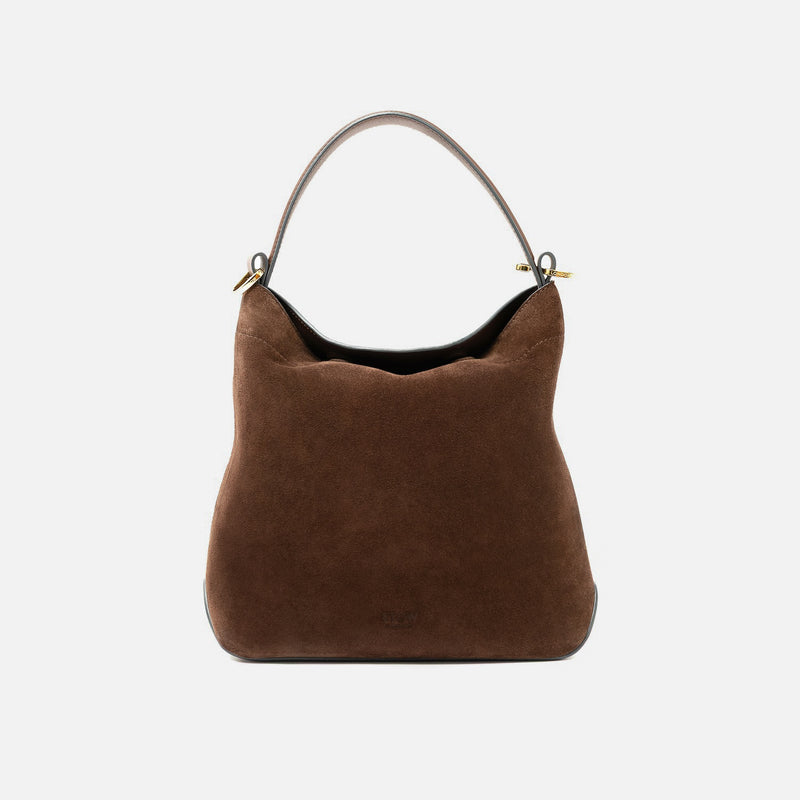STOW London's Midi Curve in Chocolate suede leather styled as a flap bag featuring gold-coated stainless steel hardware on a light grey background