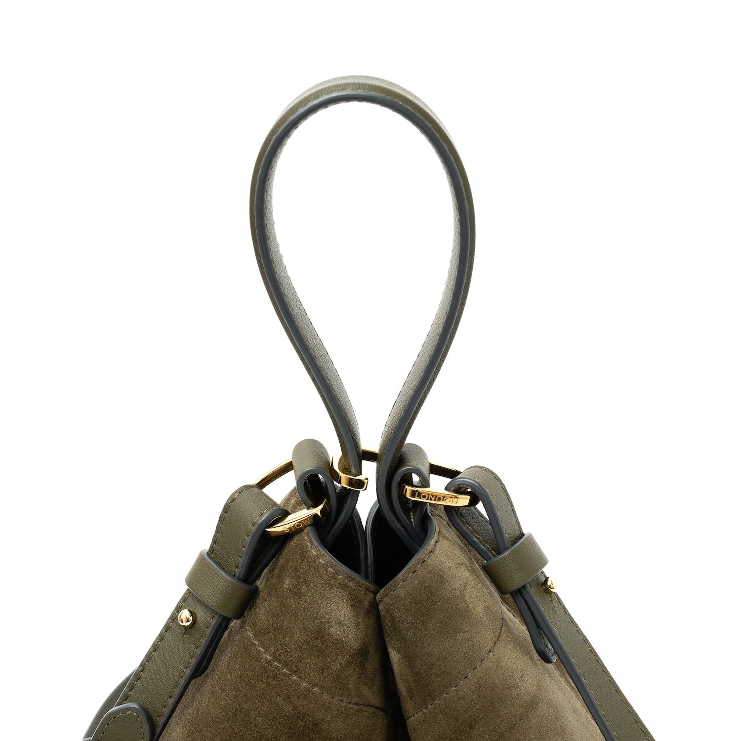 Close up of top handle, clip and detachable strap on STOW London's Midi Curve bag in Dark Green Suede leather featuring gold-coated stainless steel hardware on a white background