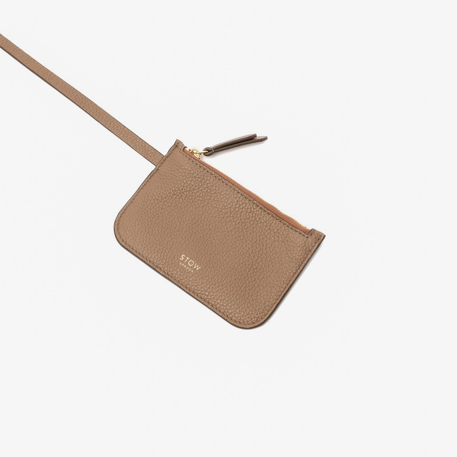 Close up of the detachable interior pouch from STOW London's Midi Curve in Mocha pebbled leather on a light grey background