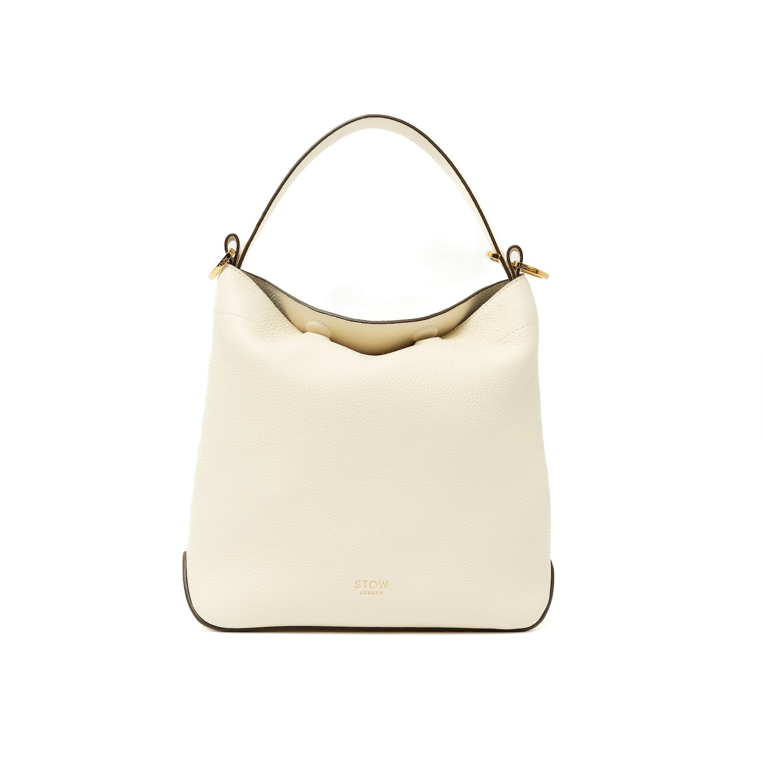 STOW London's Midi Curve bag in Spring Moon pebbled and smooth leather styled as a flap bag featuring gold-coated stainless steel hardware on a white background