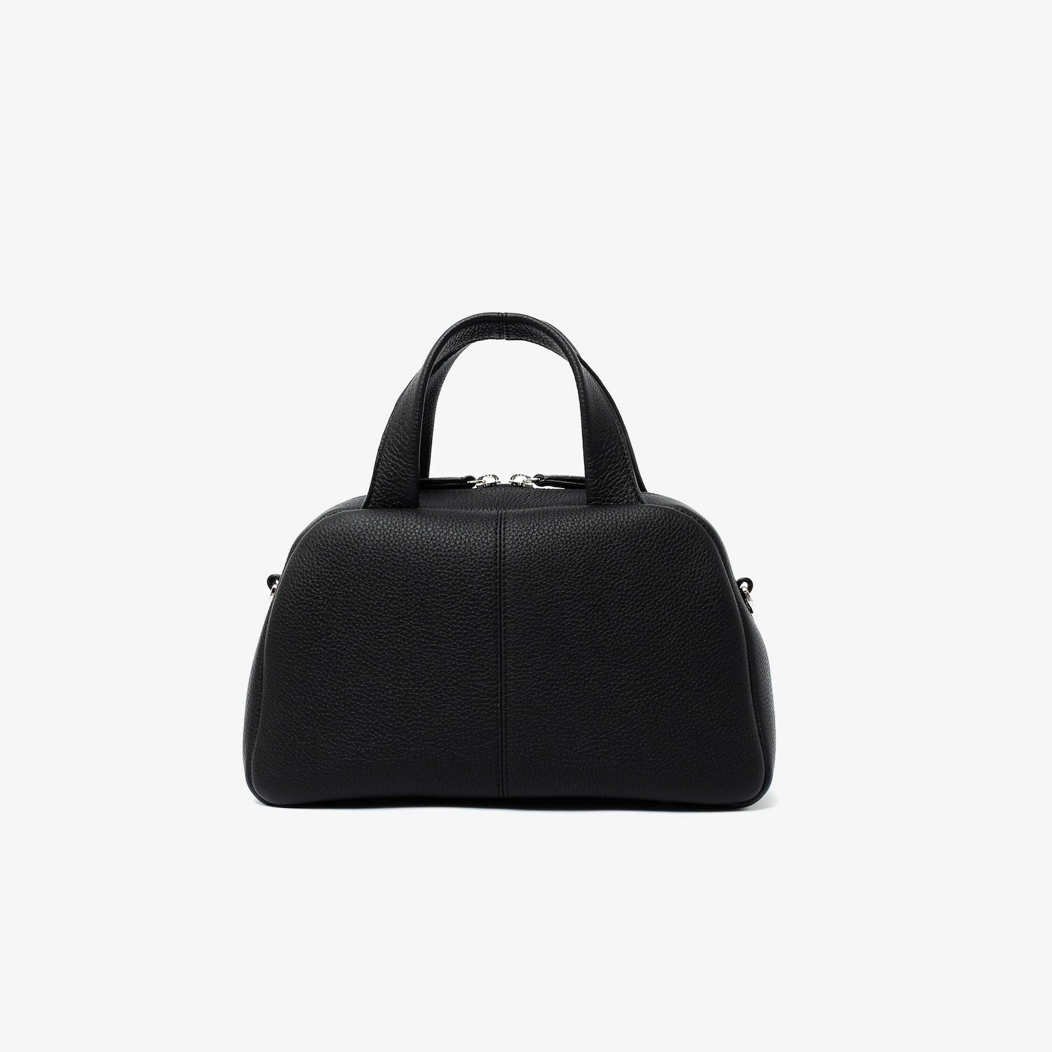 Back panel of STOW London's Mini Bowling bag in Black pebbled leather featuring silver stainless steel hardware and four feet on the base on a light grey background
