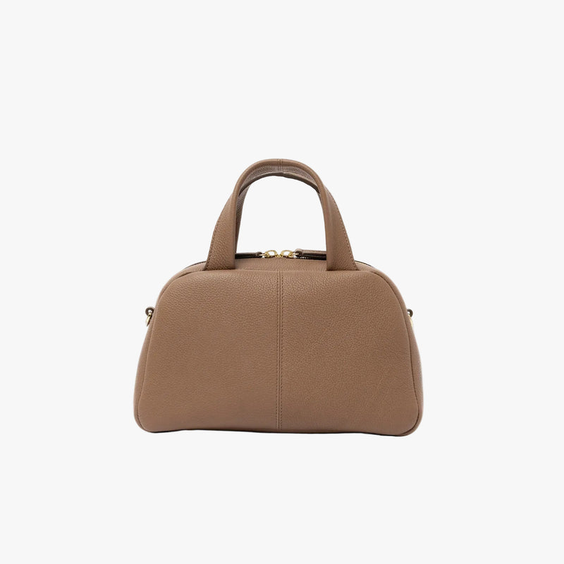 Back panel of STOW London's Mini Bowling in Mocha pebbled leather featuring gold-coated stainless steel hardware on a light grey background