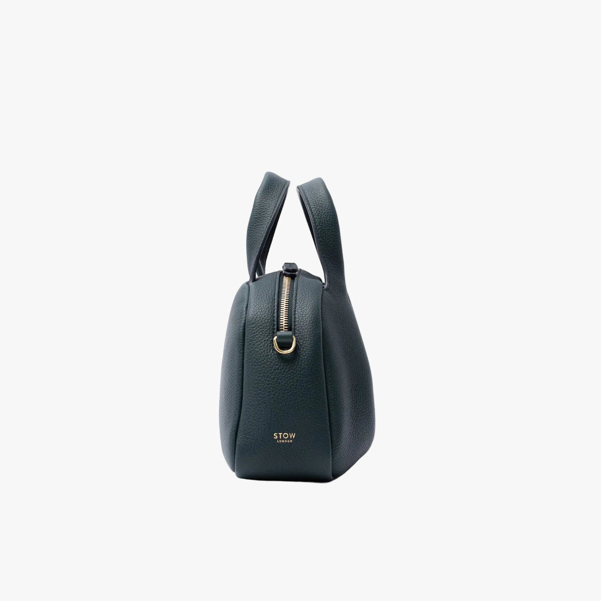 Side view of STOW London's Mini Bowling in New Forest pebbled leather on a light grey background featuring gold-coated stainless steel hardware and small embossed logo