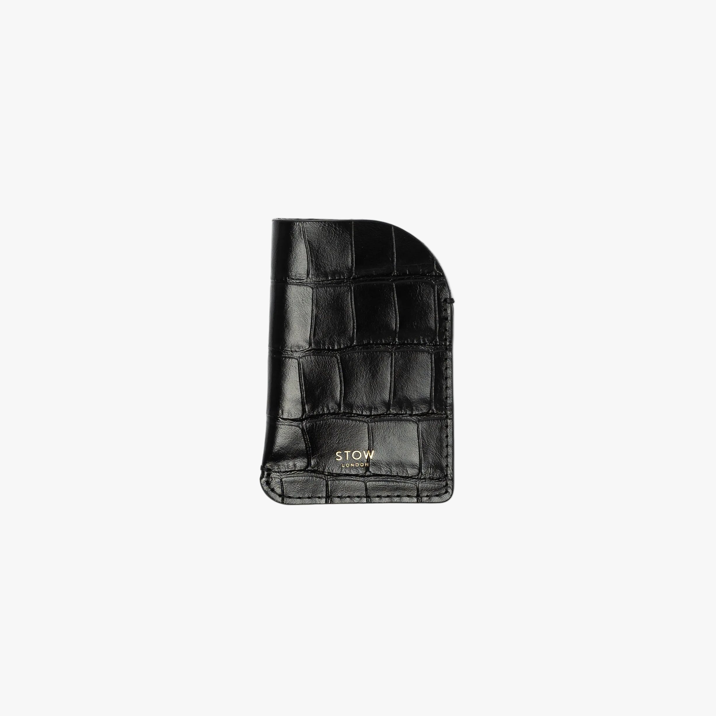 STOW London's Mini Cardholder in Black Embossed Croc leather on a light grey background featuring a small gold embossed logo on the front bottom