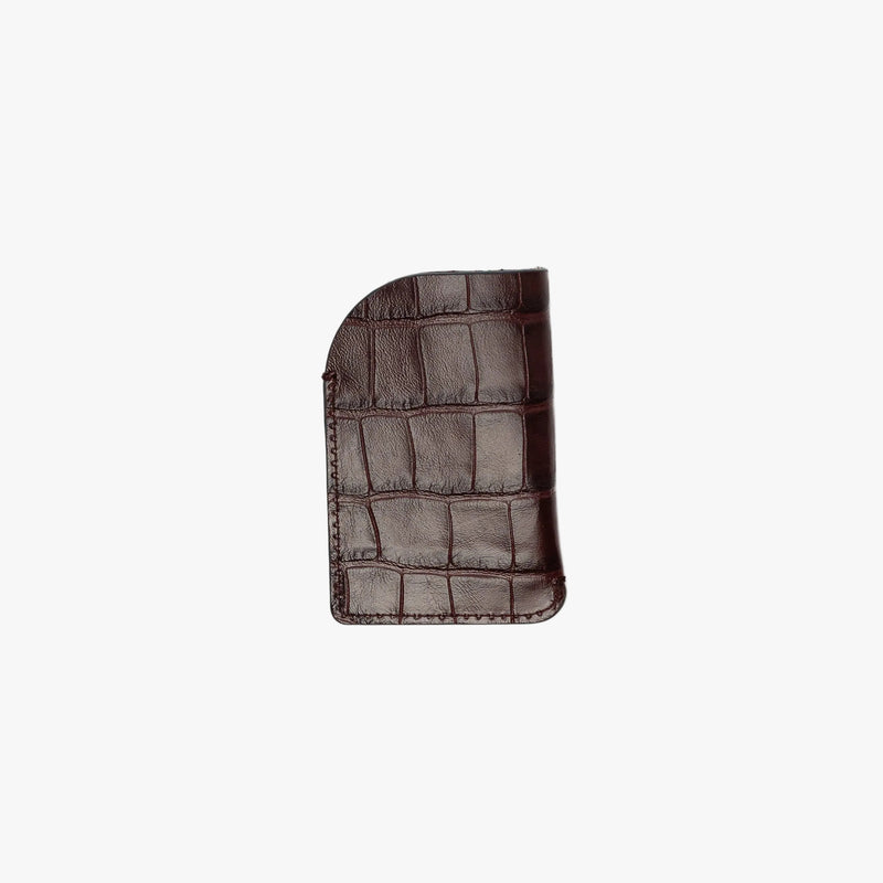 Back panel of STOW London's Mini Cardholder in Burgundy Embossed Croc leather on a light grey background