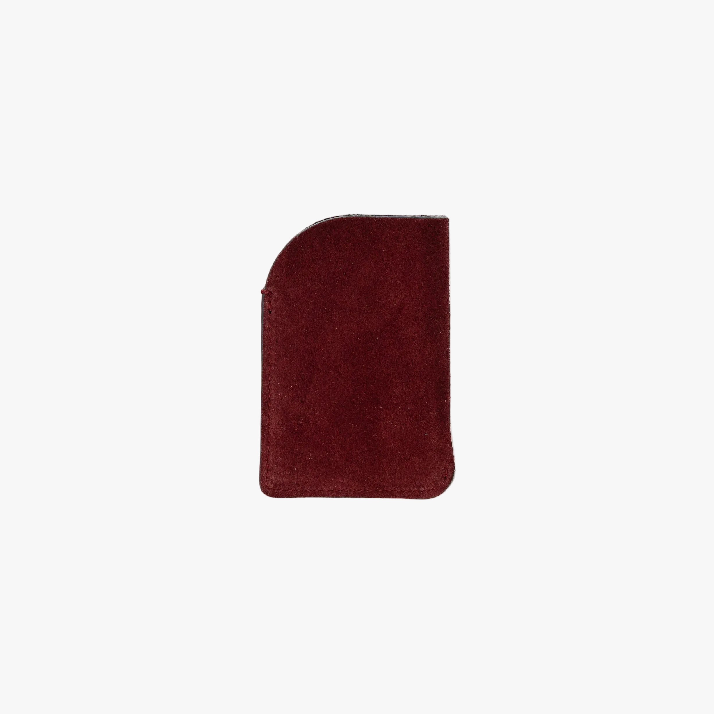Back panel of STOW London's Mini Cardholder in Burgundy Suede leather on a light grey background