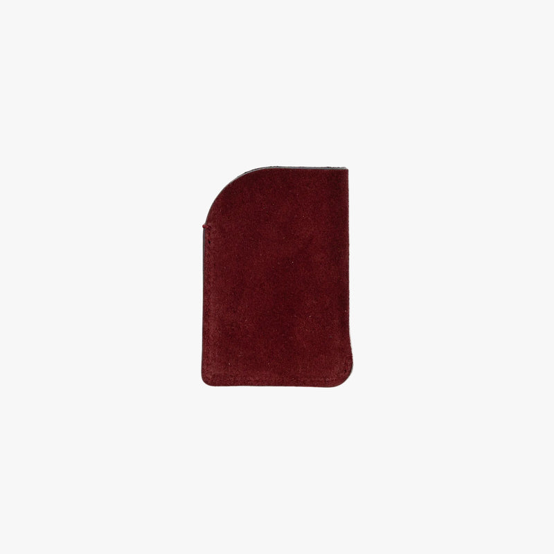 Back panel of STOW London's Mini Cardholder in Burgundy Suede leather on a light grey background