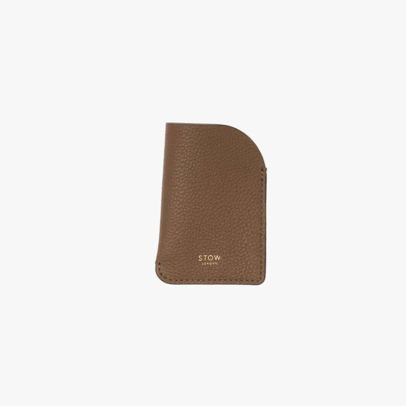STOW London's Mini Cardholder in Mocha pebbled leather on a light grey background featuring a small gold embossed logo on the front bottom