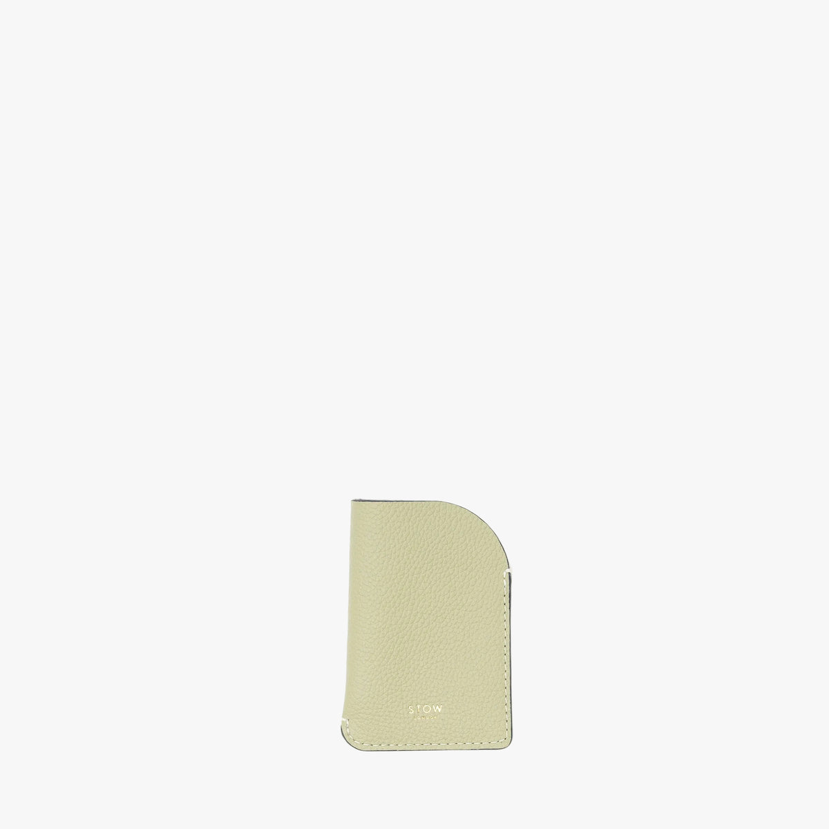 STOW London's Mini Cardholder in Pale Green pebbled leather on a light grey background featuring a small gold embossed logo on the front bottom