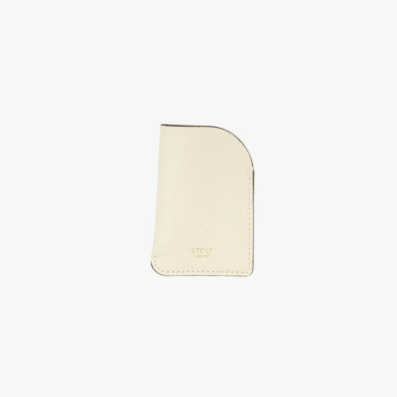 STOW London's Mini Cardholder in Spring Moon pebbled leather on a light grey background featuring a small gold embossed logo on the front bottom