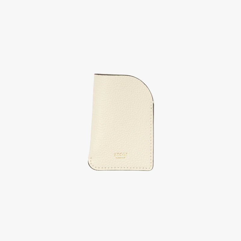STOW London's Mini Cardholder in Spring Moon pebbled leather on a light grey background featuring a small gold embossed logo on the front bottom