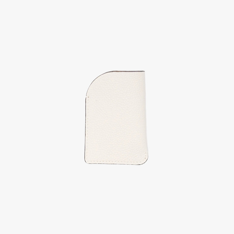 Back panel of STOW London's Mini Cardholder in Spring Moon pebbled leather on a light grey background 