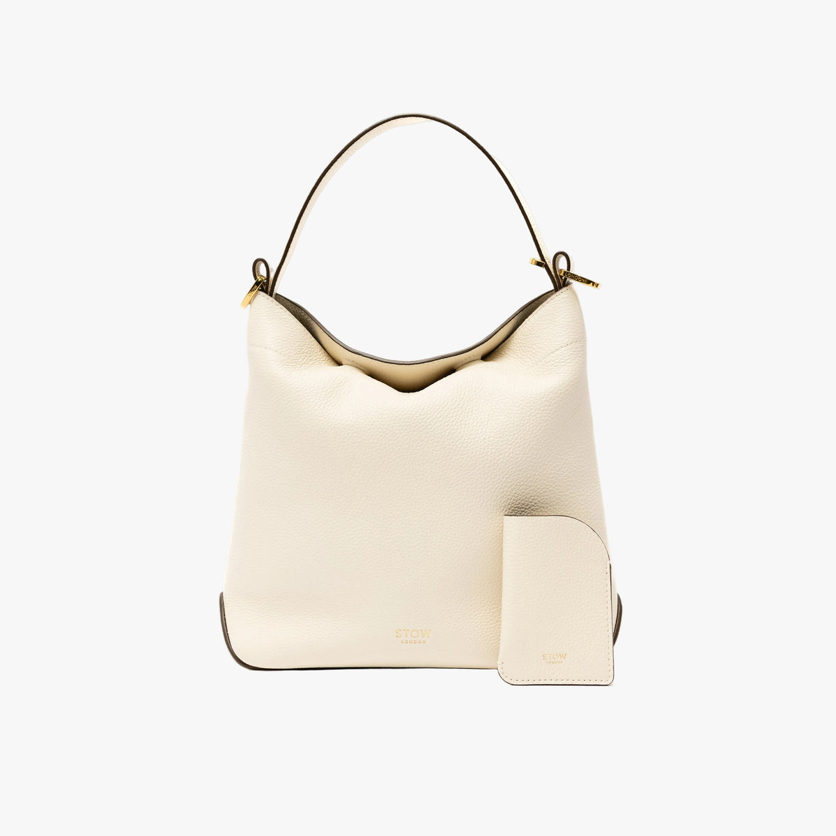 STOW London's Mini Cardholder in Spring Moon pebbled leather with the matching Midi Curve bag on a light grey background featuring a small gold embossed logo on the front bottom of both pieces